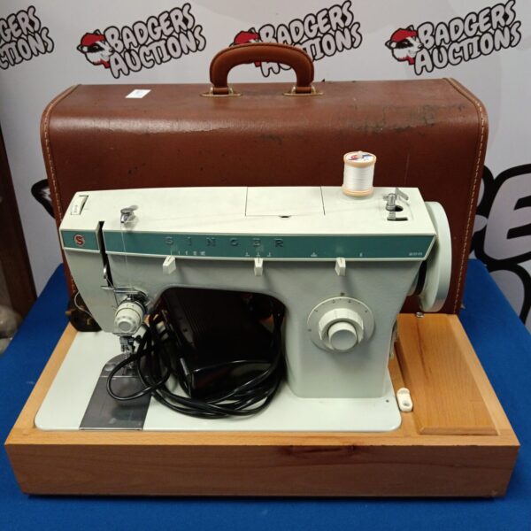 Vintage Singer 256 electric sewing machine in original case.