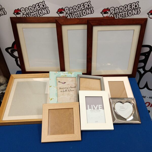 Assorted picture frames lot for displaying photos and artwork.