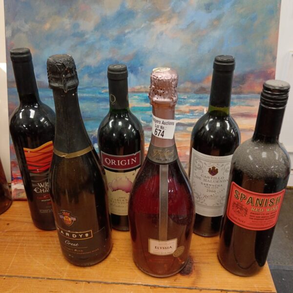 Six bottles of red wine including Hardys and Castillo de Maluenda.