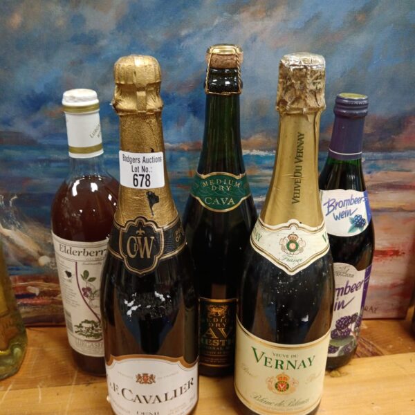 Vintage wine collection with G f cavalier bottle displayed.
