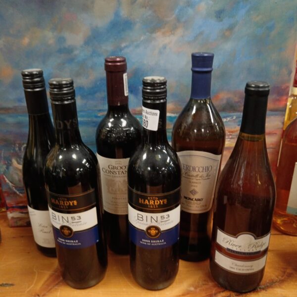 Wine lot featuring Hardys Bin 53 and Groot Constantia bottles.
