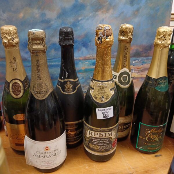 Six bottles of champagne including Heidsieck and Amarande in a collection.