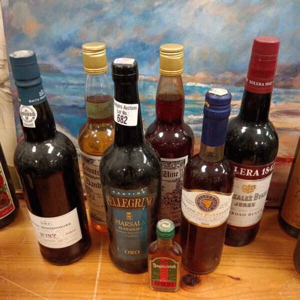 Vintage wine and alcohol lot including Smith Woodhouse and Pellegrino bottles.