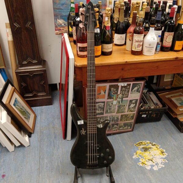 Dark finished Rogue 5 string bass guitar presented for auction.