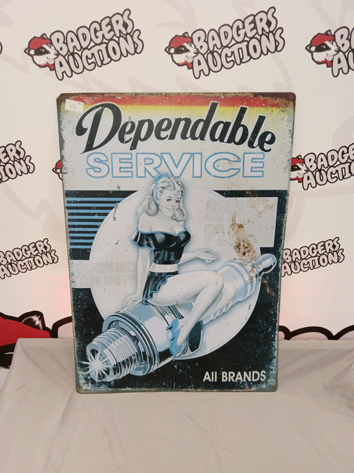 716 Dependable service spark plug tin sign