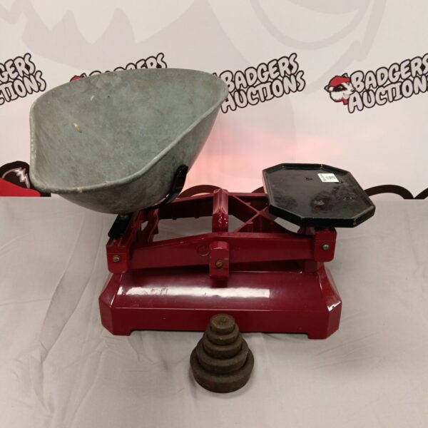 Antique cast iron grocers scales with weights for kitchen use.