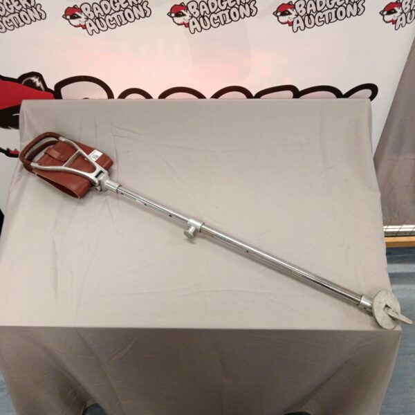 Vintage shooting stick with leather seat for game shooting.