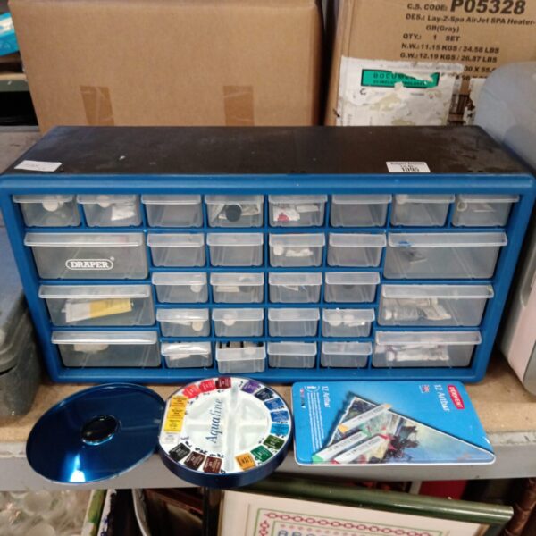 Blue Draper tool storage drawers filled with parts and paints.