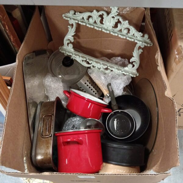 Vintage enameled kitchenware lot with colorful pots and pans.