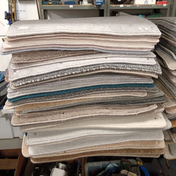 Diverse lot of carpet right samples for flooring and interior design.