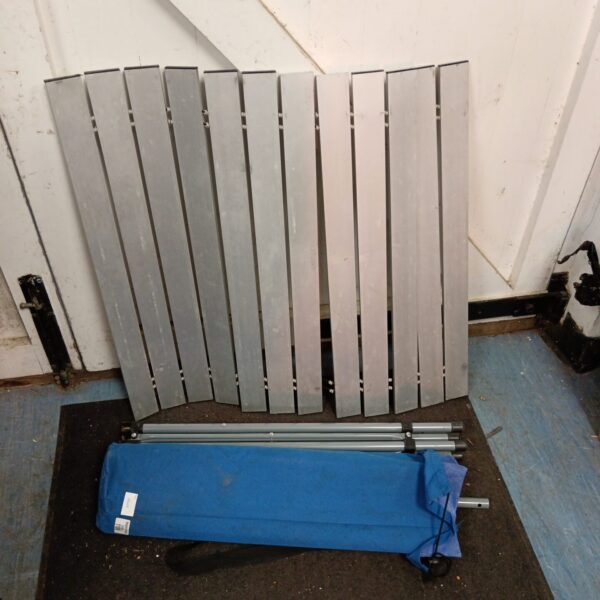 Metal frame of a used folding camping table.