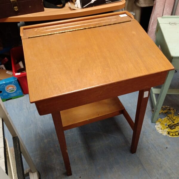 Vintage teak school desk with slanted surface.