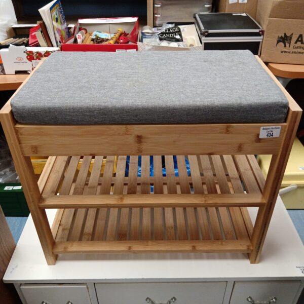 Small pine shoe rack bench with cushioned seat for hallway storage.