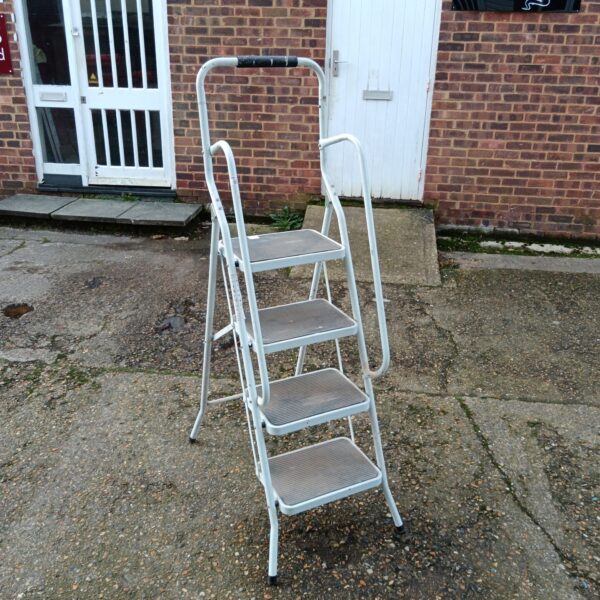 Used metal folding step ladder for home or garden use.