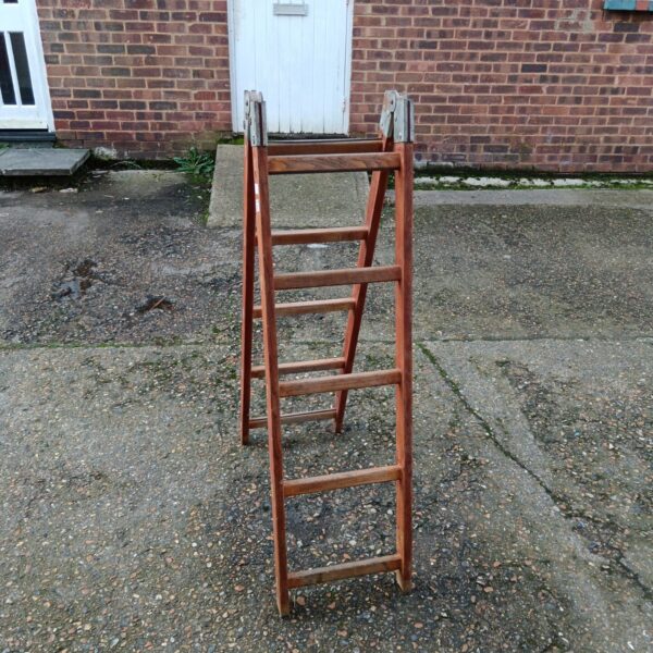 Vintage wooden folding ladder with ten rungs, ideal for garden or farmhouse use.