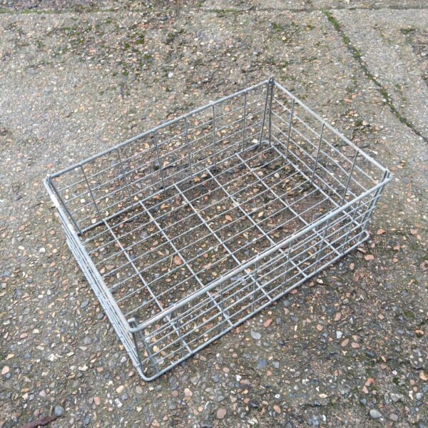 Vintage galvanised metal basket for storage and display.
