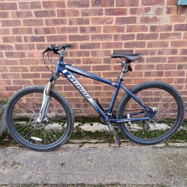 Blue Specialized Hardrock mountain bike for off-road cycling.
