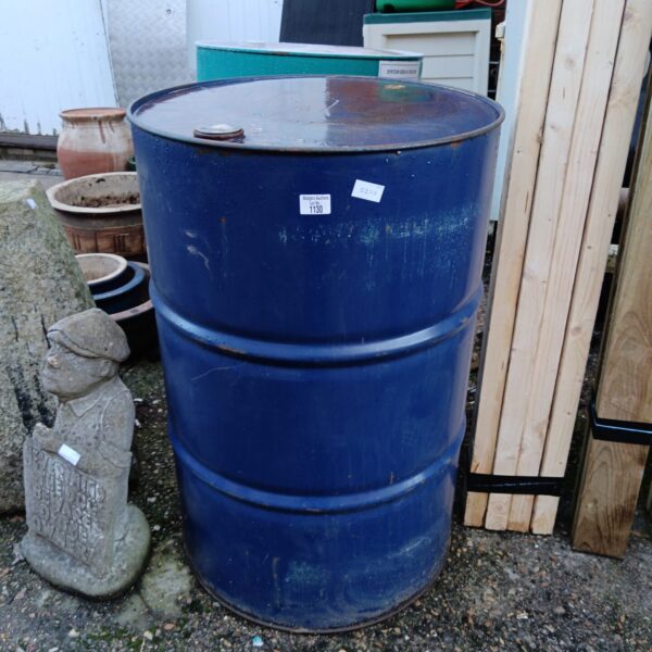 Large blue industrial oil drum for storage or repurposing.
