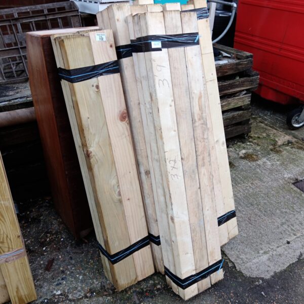Four bundles of 4ft length timber for construction and DIY projects.