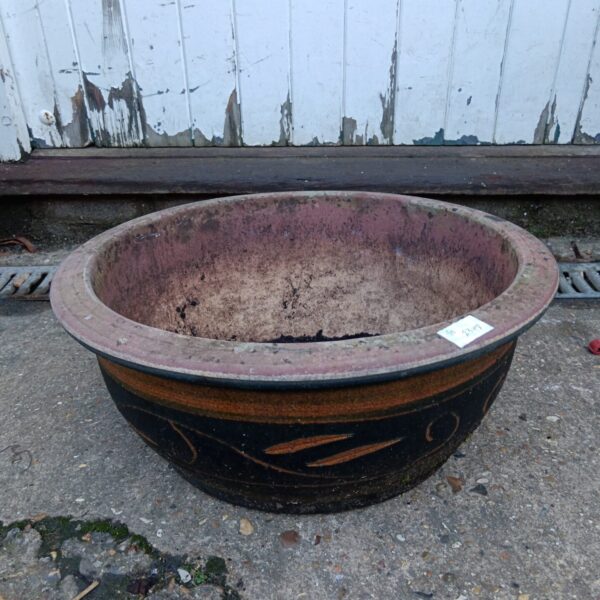 Large weathered terracotta pottery planter for garden use.