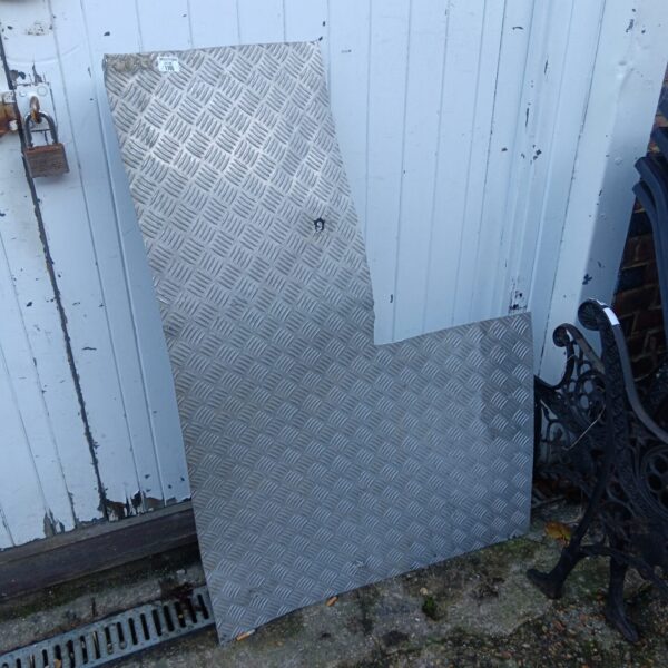 Steel chequer plate sheet with diamond pattern.