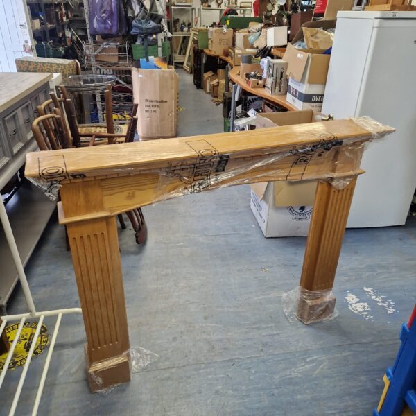 Antique oak fire surround with carved detailing, measuring 52/41/7.5”.