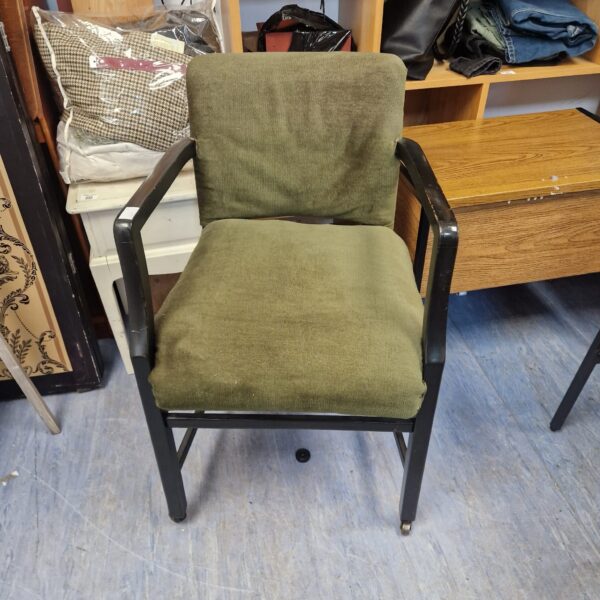 Vintage green upholstered office chair with swivel base.
