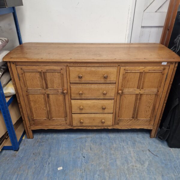 Vintage Ercol Golden Dawn sideboard in warm wood tones.