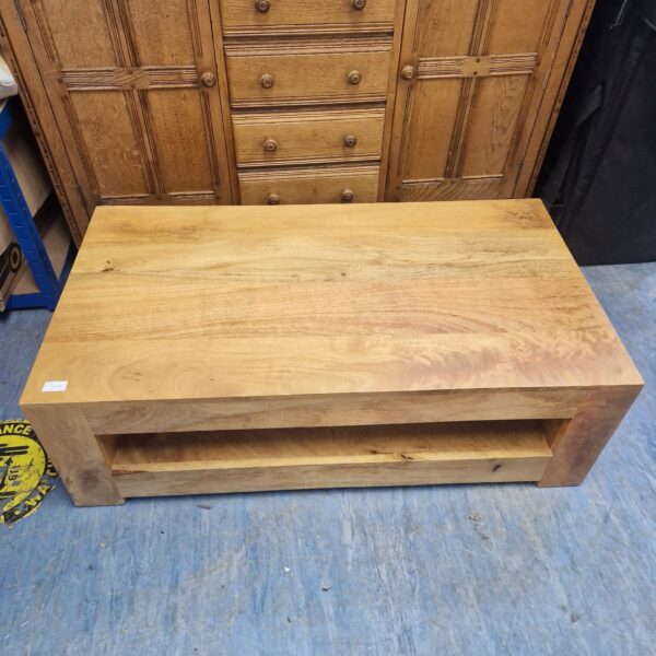 Rustic solid wood coffee table for living room use.
