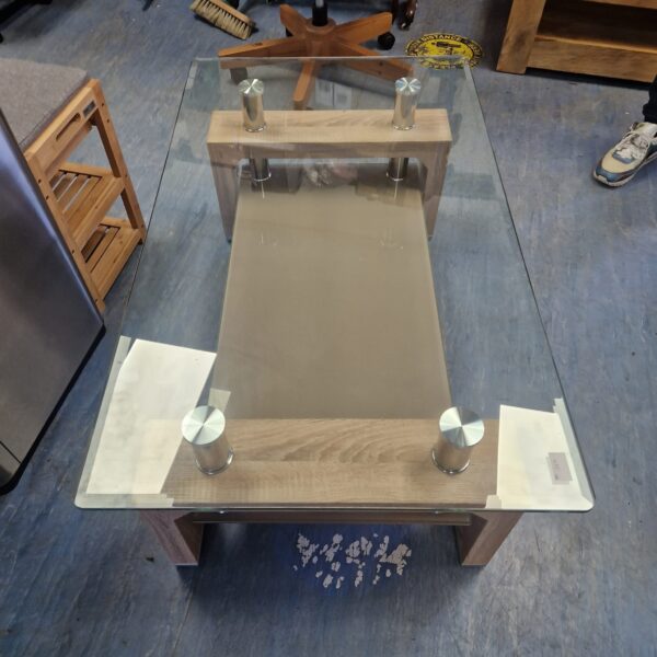 Modern glass top coffee table with chrome legs.