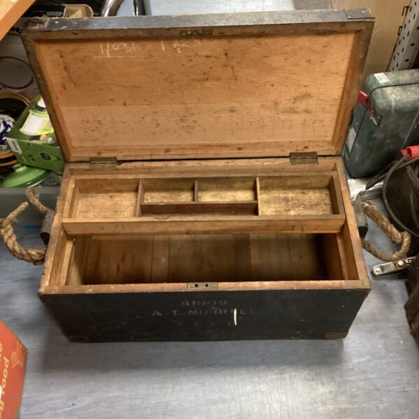 Vintage wooden carpenter’s toolbox with a carrying handle.