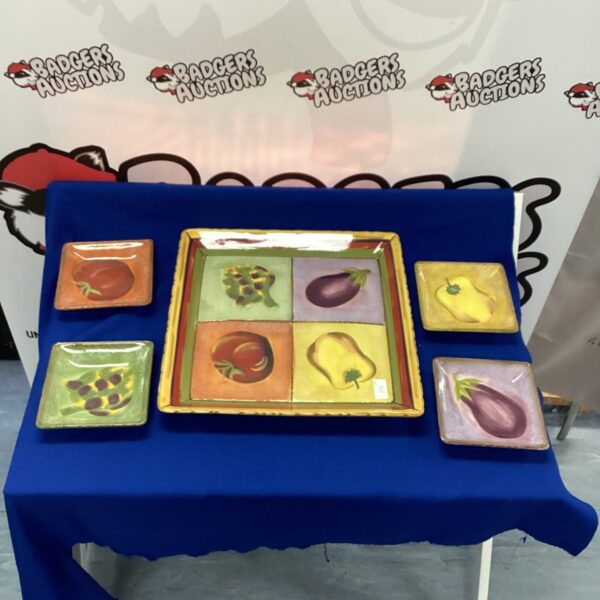 Colourful clay art tray and plates with fruit designs.