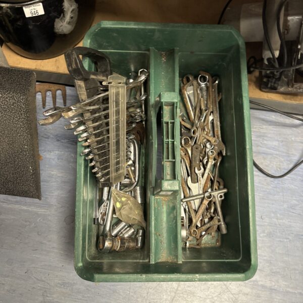Tray of assorted spanners and wrenches for workshop use.