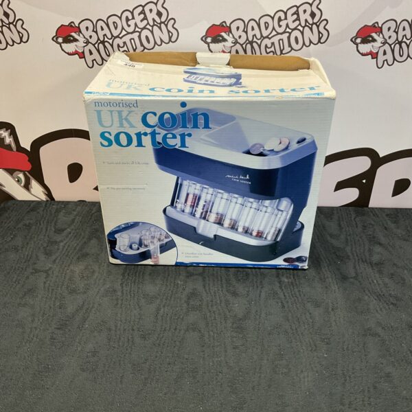 Used motorised coin sorter for UK currency, side view.