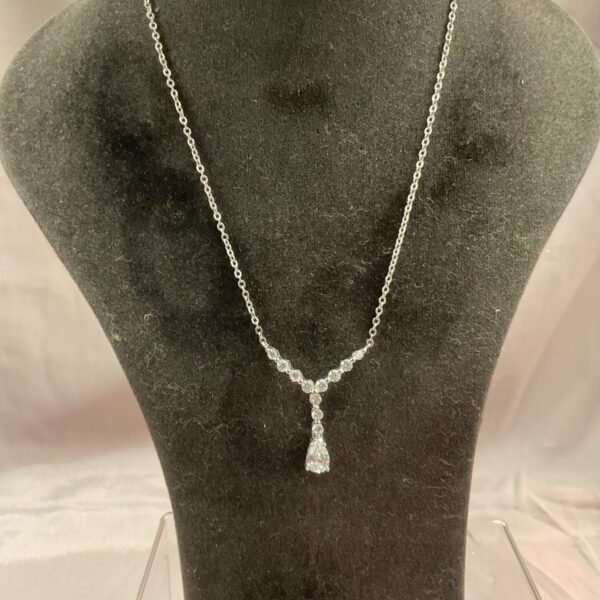 Delicate silver necklace with a luminous whitestone pendant.
