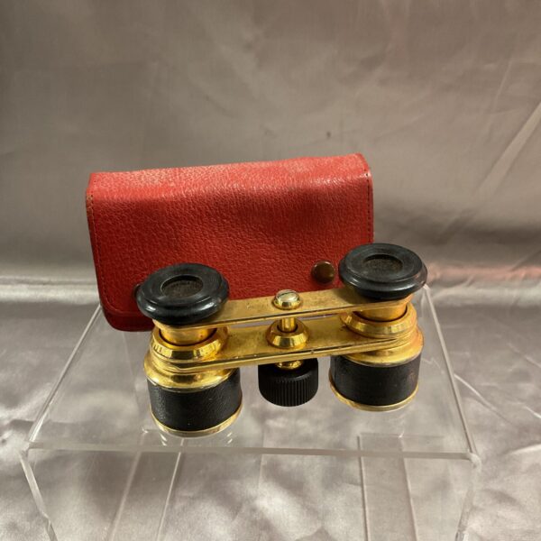 Vintage Altex Paris opera glasses with red leather case displayed.