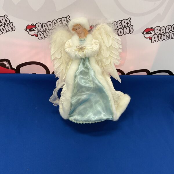 Large Christmas angel decoration with detailed wings and flowing robes.