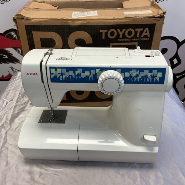 Vintage Toyota RS2000 sewing machine in original box.