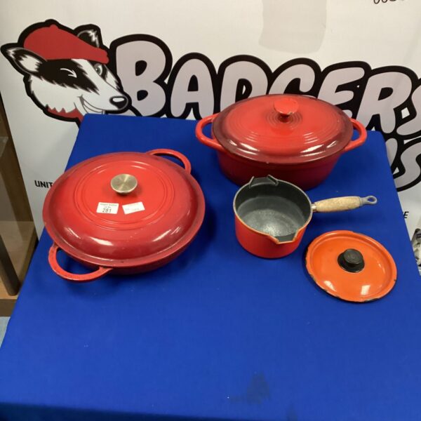 Red enamel Ejernesto cast iron casserole dish for cooking.
