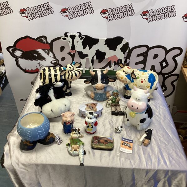 Vintage ceramic cow money box and farm animal collection.
