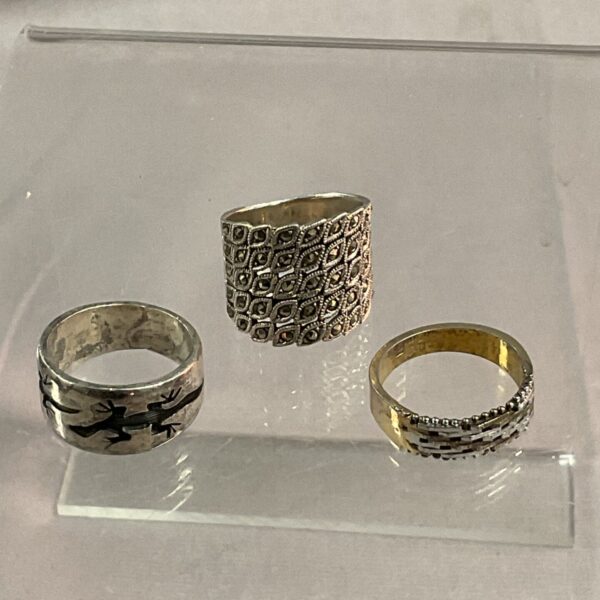 Lot of three 925 silver rings with varied designs.