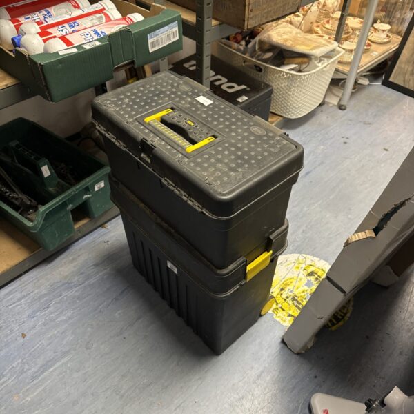 Black plastic toolbox for workshop tool storage.