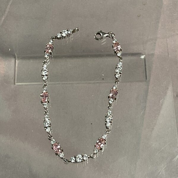 Elegant 925 silver bracelet with pink and white stones.