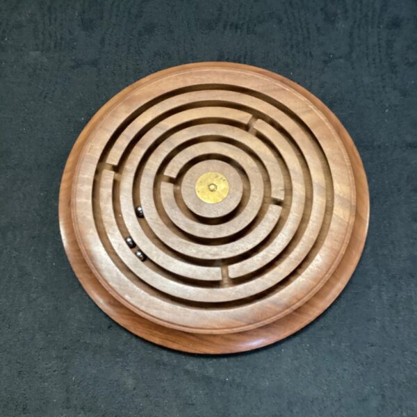 Classic wooden labyrinth toy with intricate maze design.