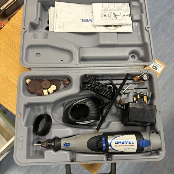Dremel Multi Pro cordless tool in open carrying case with attachments.
