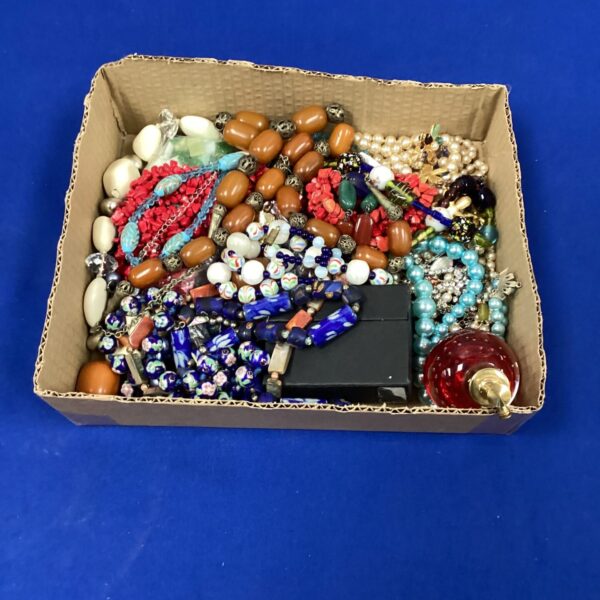 Mixed lot of colourful vintage costume jewellery and bead necklaces.