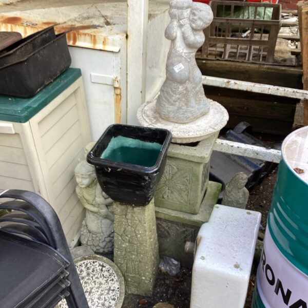 Vintage cherub garden fountain statue with tiered design.