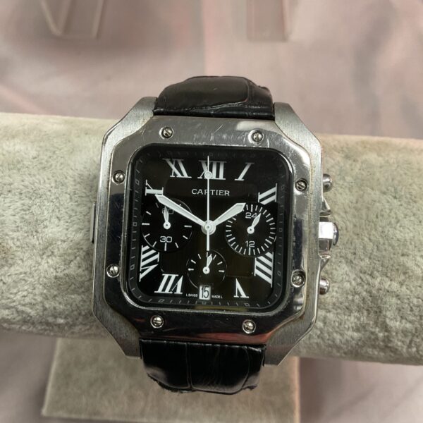Black dial Cartier Santos 100 style watch with blue crown.