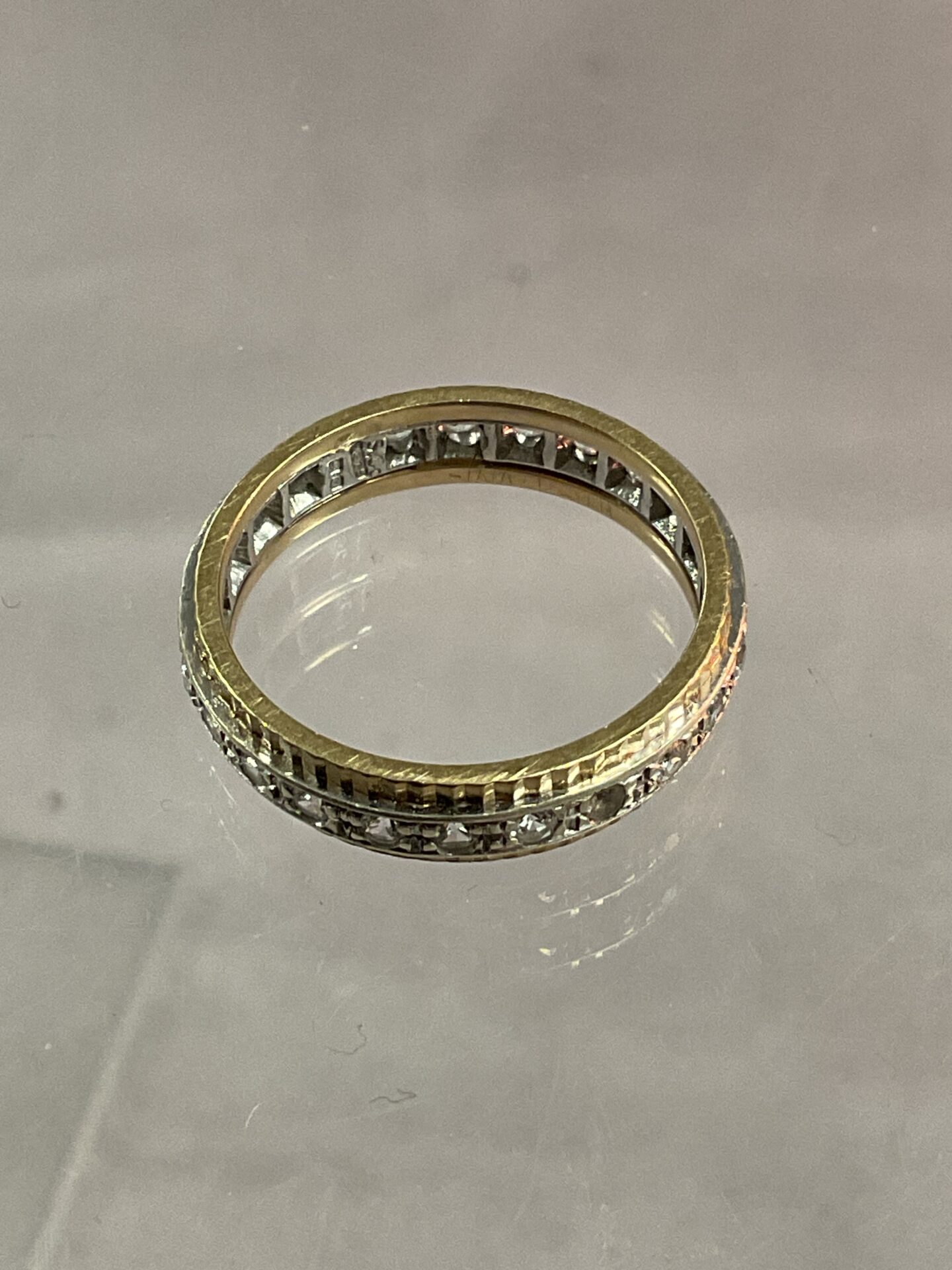 864 9ct White and yellow gold ring set with white stones 3.38g gross Size 0