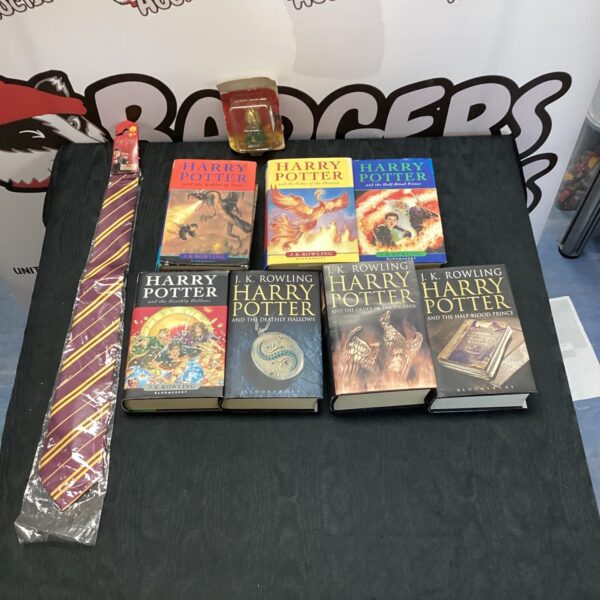 First edition Harry Potter books with golden egg collectible.